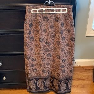 Polyester/spandex blend tan floral long skirt